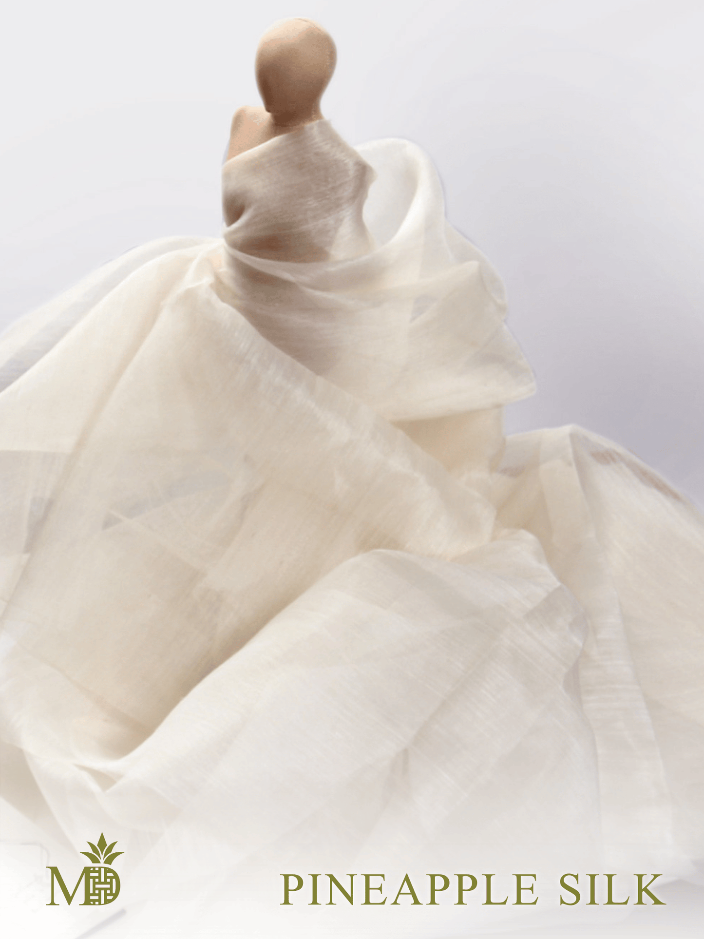 Philippine natural pineapple silk or pina silk fabric draped over a miniature mannequin against a light background by Manila Designer, handwoven sustainable textiles from the Philippines