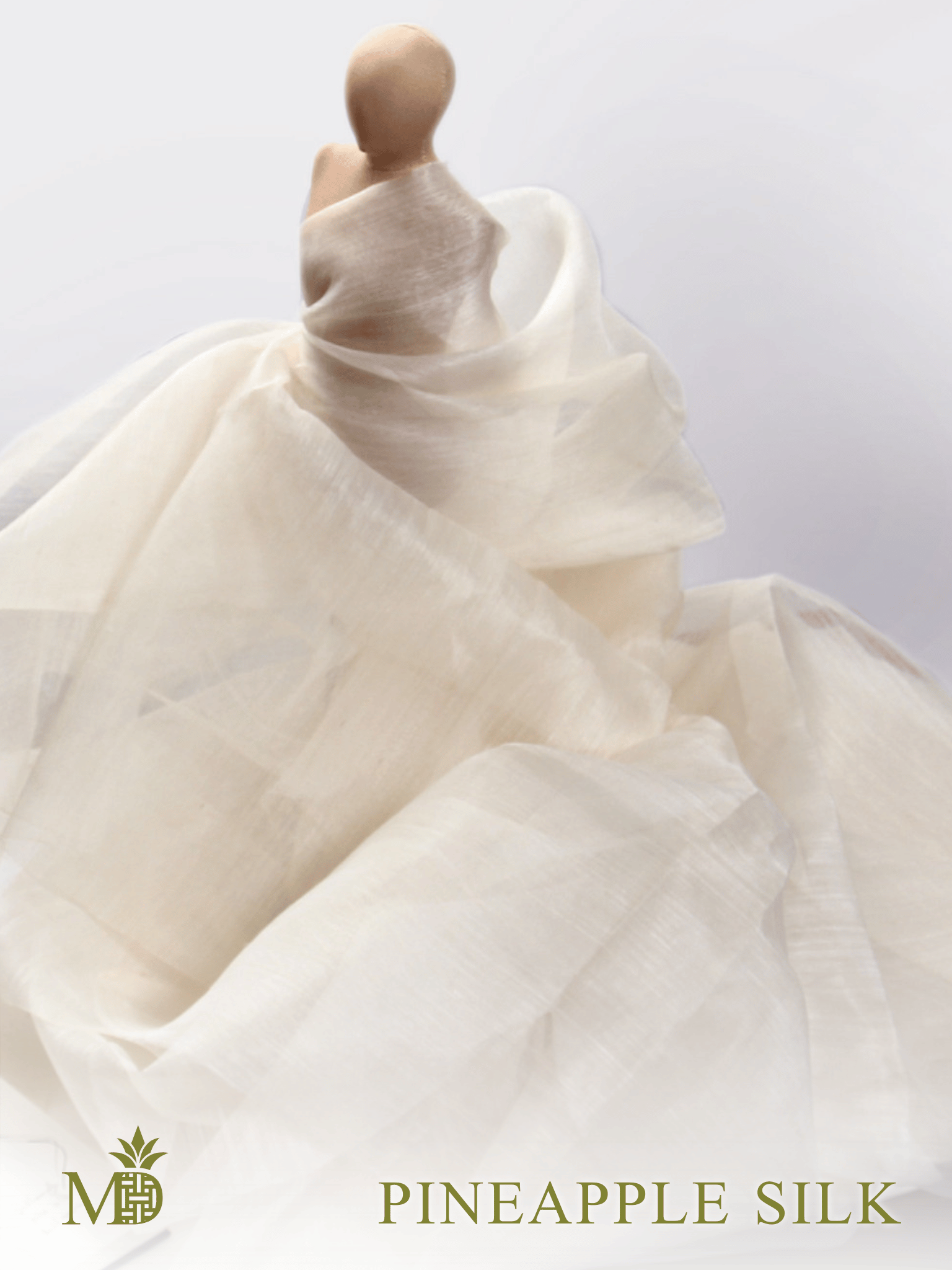 Philippine natural pineapple silk or pina silk fabric draped over a miniature mannequin against a light background by Manila Designer, handwoven sustainable textiles from the Philippines